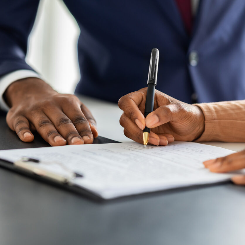 Contract Signing. Female Customer Sign Papers In Dealership Office, Unrecognizable African American Woman Client Buying New Car Or Purchasing Property, Closeup Shot, Cropped Image With Free Space