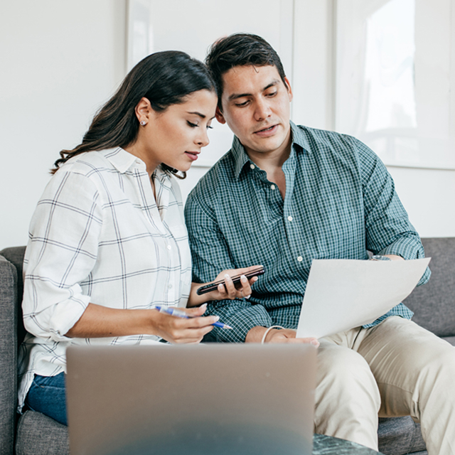 Couple looking on bank statements