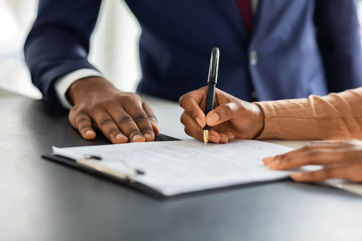 Contract Signing. Female Customer Sign Papers In Dealership Office, Unrecognizable African American Woman Client Buying New Car Or Purchasing Property, Closeup Shot, Cropped Image With Free Space